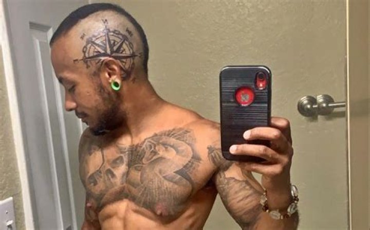 What is the Tattoo on Rick Ross's Forehead? Unpacking the Boss's Iconic Ink